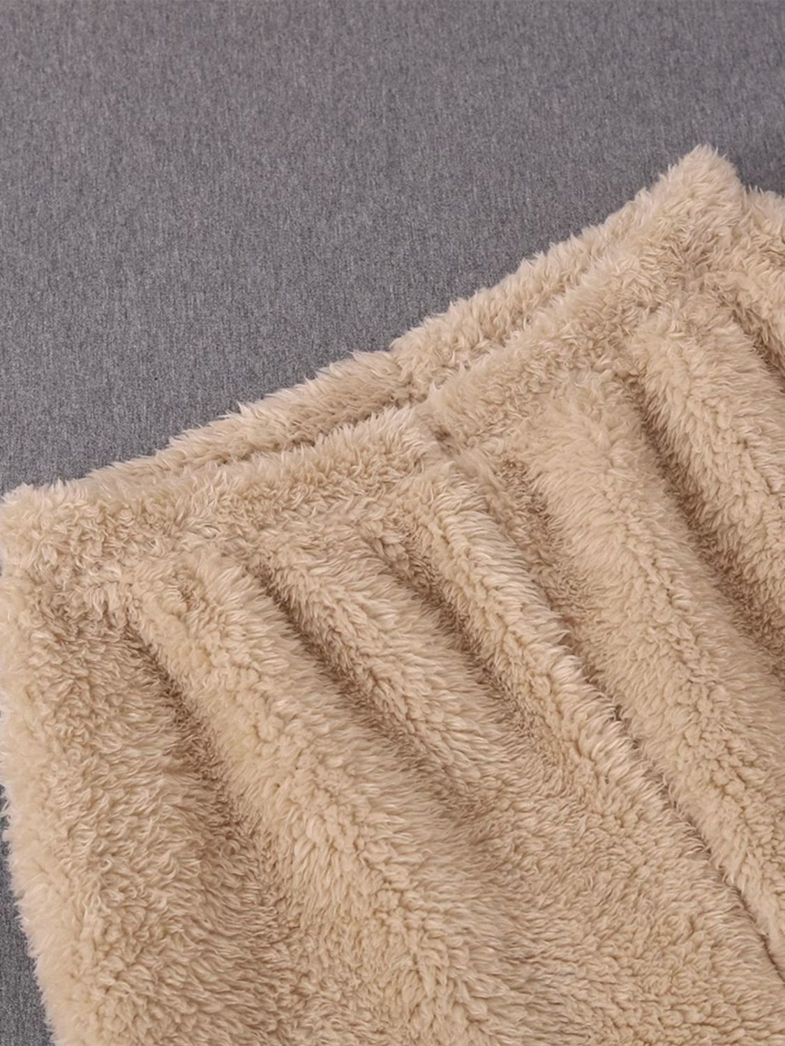 Extreme close-up of soft coral fleece fibers